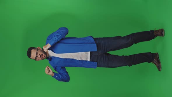 Joyful and Handsome Hipster Man Dancing Happily in Front of the Camera alt