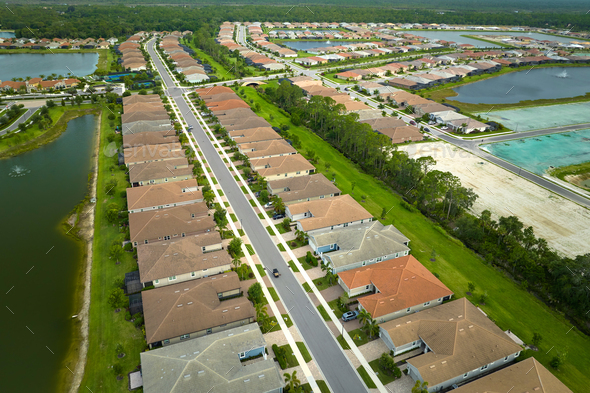 Aerial view of real estate development with tightly located family houses under construction