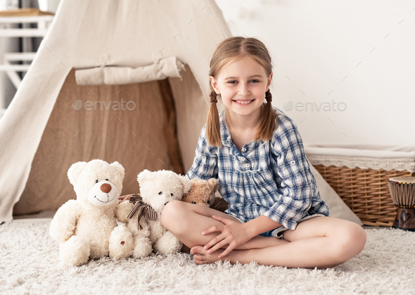 Little girl sitting near teddy bears Stock Photo by AFGreen | PhotoDune