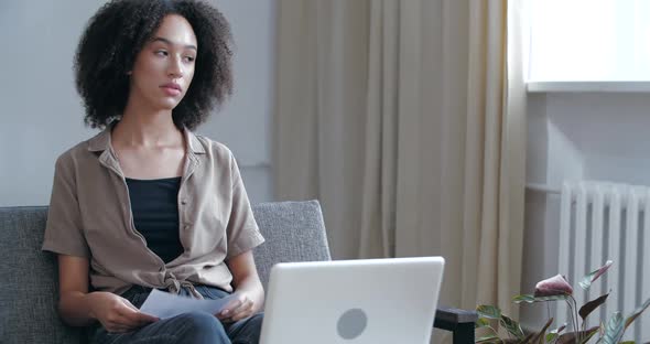 African American Girl in Casual Clothes Reads Letter Results of Medical Tests, Gets Bad News, Learns alt