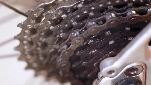 Close-up on Rear Bike Cassette Rotating with Chain. Macro Shot