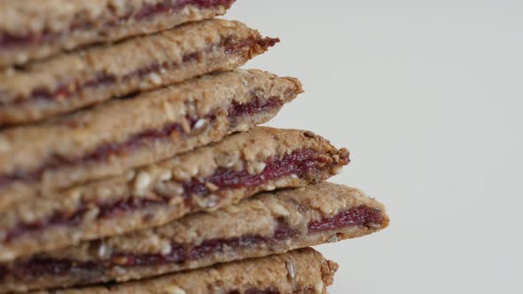 Modern chrono food snack on white background 4K 2160p 30fps UltraHD tilting footage - Homemade raspb alt