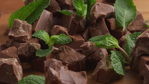 Chunks of chocolate with mint leaves
