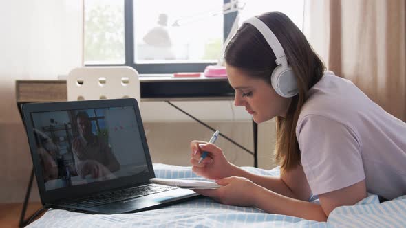 Student Girl with Laptop Learning Online at Home