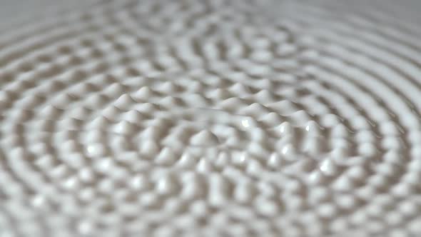 Flat White Surface of Milk Begins to Vibrate to Frequency of Speaker alt