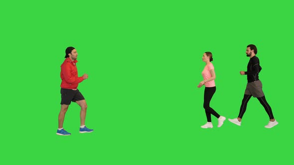 Many Different Sporty People Walking in Front of the Camera on a Green Screen Chroma Key alt
