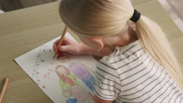 Girl Is Drawing Small Poster To Encourage People Stay Home alt