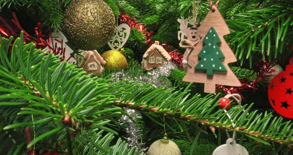 Closeup of Christmas tree from inside. Decorated green Christmas tree. alt