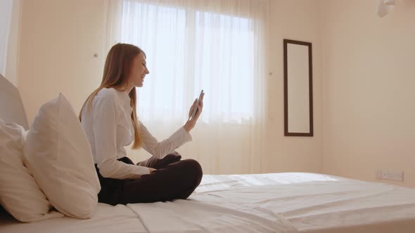 Positive Caucasian Woman Smiling and Waving Hands During Video Conference on alt