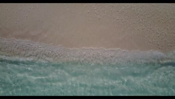 Aerial drone panorama of tranquil seashore beach voyage by blue sea and white sandy background of a  alt