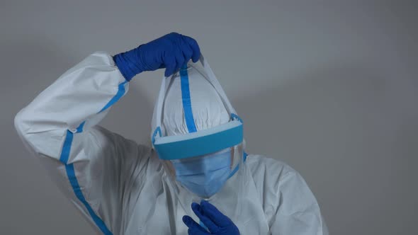 Doctor wearing medical protective suit and mask