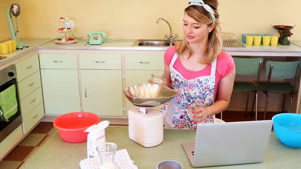 Waitress preparing food while using laptop 4k alt