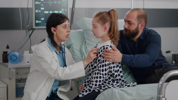 Pediatrician Woman Doctor Consulting Sick Girl Patient Listening Lungs Using Medical Stethoscope alt