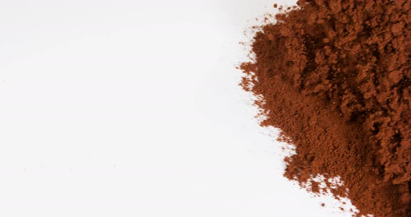 Star Anise illicium verum,, powder falling against White Background, Slow Motion 4K alt