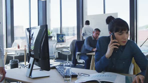 Young woman talking to mobile phone alt