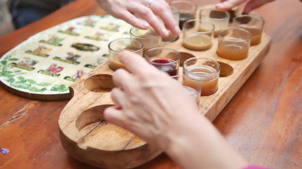 Closeup View of Tourists Hands and Tray with Various Coffee and Tea Drinks at Kopi Luwak Farm During alt