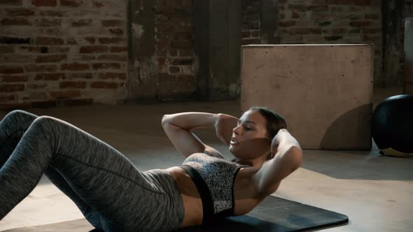 Sport woman doing abs crunch exercise, fitness workout at gym alt