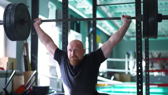 Strong Masculine Sportsman with Red Beard Lifting Barbell Putting Down Equipment in Slow Motion and alt