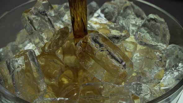 Pouring Cola into a Glass with the Ice Cubes. stock video alt