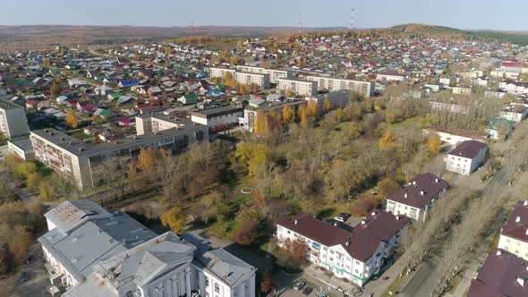 Aerial view of park next to house of culture and three-story and five-story houses 58 alt