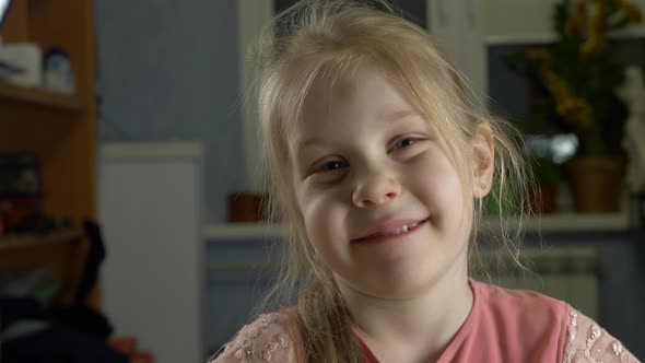 Little Child with Blond Hair Smiling alt
