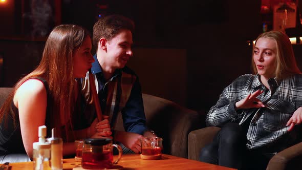 Authentic People Friends Party in Hookah Lounge Smoking Shisha Night Time alt