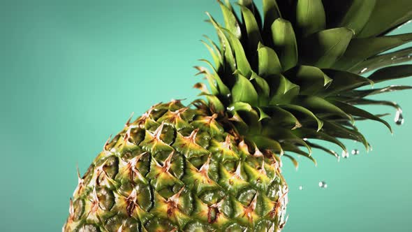 Super Slow Motion Water Drips on Rotating Pineapple alt