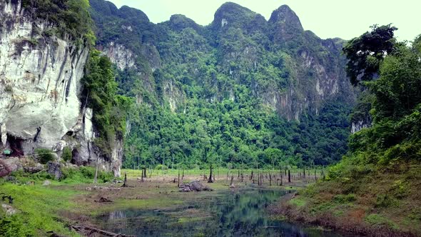 Cinematic Aerial Shot Flying Through Cheow Lan Lake Khao Sok Thailand alt