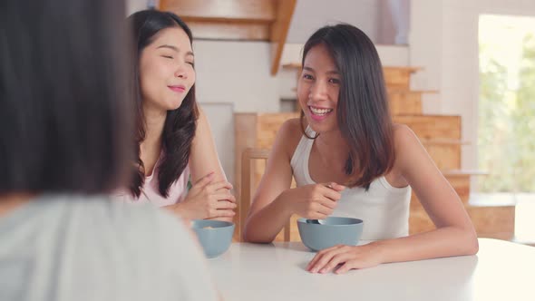 Asian women have breakfast at home. alt