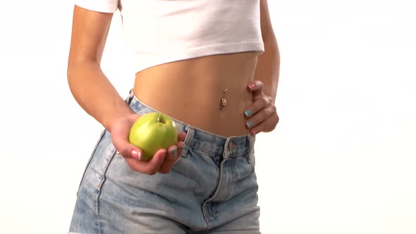 Slim Woman with Apple in Her Hand, on White Background alt