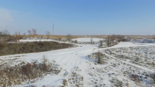 Aerial View Girl in Field in Winter