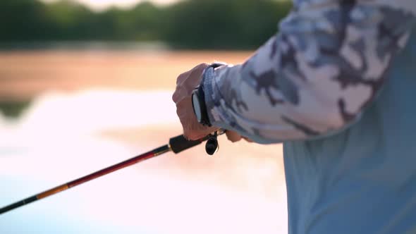 Handle Rotation with Reel of Fishing Rod Close Up