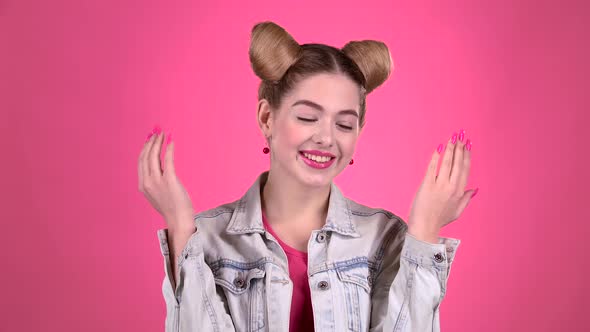 Girl Is Dancing Energetic Movements. Pink Background. Slow Motion alt