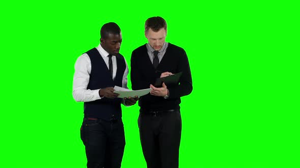 Businessmen Consider the Documents. Green Screen alt