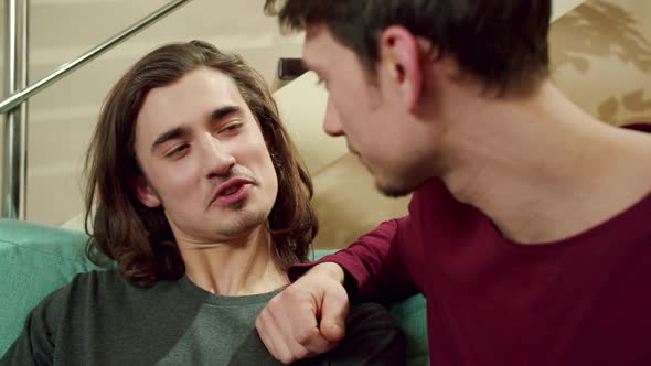 A Lovely Couple is Sitting in an Embrace and Talking Nicely alt