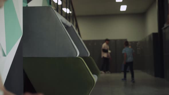 Cute Focused Girl Sitting Bench in School Hallway Close Up alt
