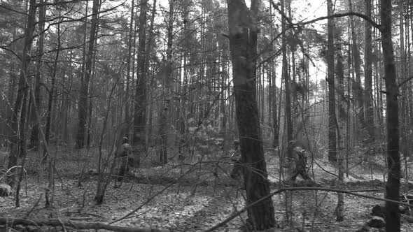 Men Dressed As American Soldiers Of USA Infantry Of World War II Marching Run Running Along Forest alt
