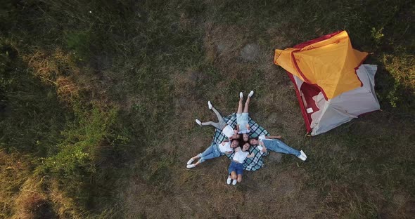 Summer rest of children in tents on the nature. View from height. alt