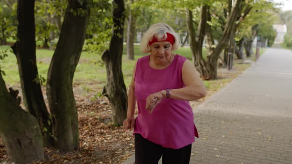 Elderly Sport Runner Woman Training. Workout Cardio in Park. Active Senior People. Fitness alt