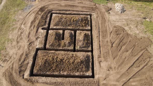 Dug Out Trench for Building Works of New House Concrete Foundation on Construction Site alt