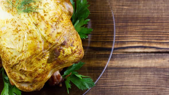 a Whole Baked Chicken with Herbs and Lemon Slices Lies on alt