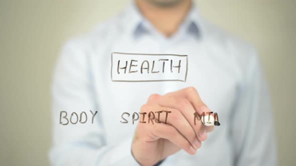 Health Concept, Businessman Writing on Transparent Screen alt