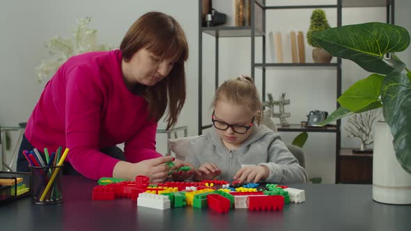 Caring Mom Developing Disabled Kid Skills with Learning Games alt