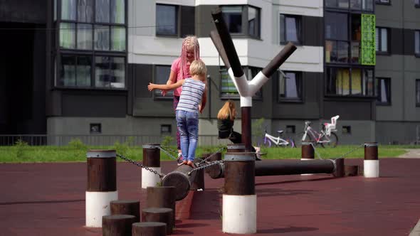Life of People in a Modern City - Children Is Having Fun on the Playground Near the House