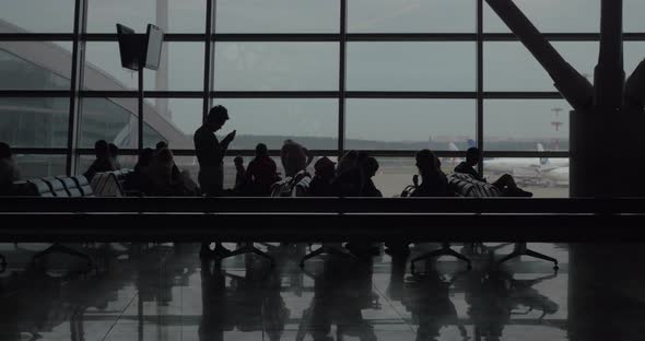 Passengers in waiting room alt