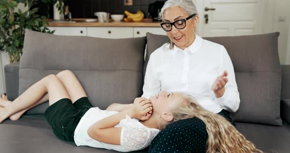 Grandmother Relaxing with Granddaughter