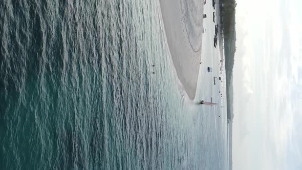 Vertical Video of the Beach on Zanzibar Island Tanzania Aerial View alt