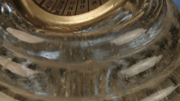 Antique pen and ink on a black reflective surface alt