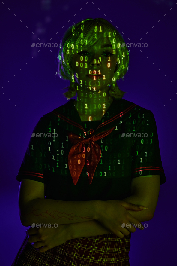 young female student in neon programming code projection on blue ...