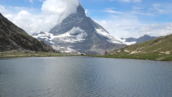 Scenic view on snowy Matterhorn peak and lake Stellisee, Zermatt